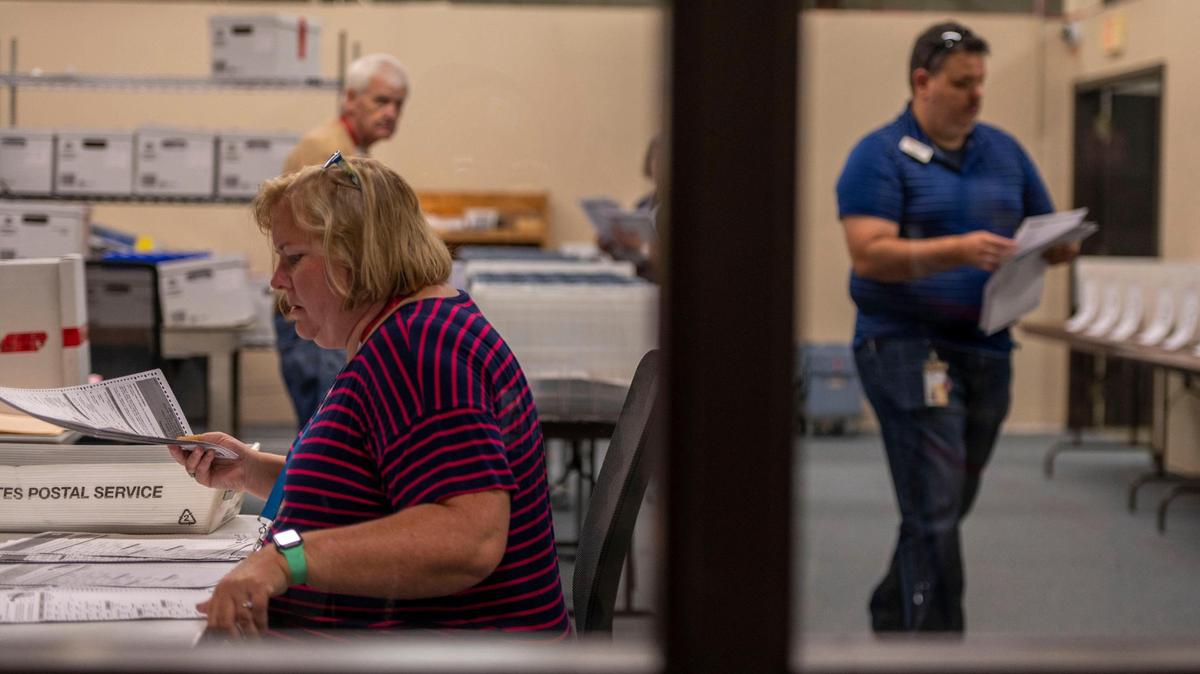 Election workers sort out voter ballots at the Johnson County Election Office on Tuesday, Aug. 16, 2022, in Olathe. Kansas’ largest counties will undergo a recount of ballots from the August 2, election in an attempt by Value Them Both supporters to overturn the state’s vote in favor of abortion rights.
