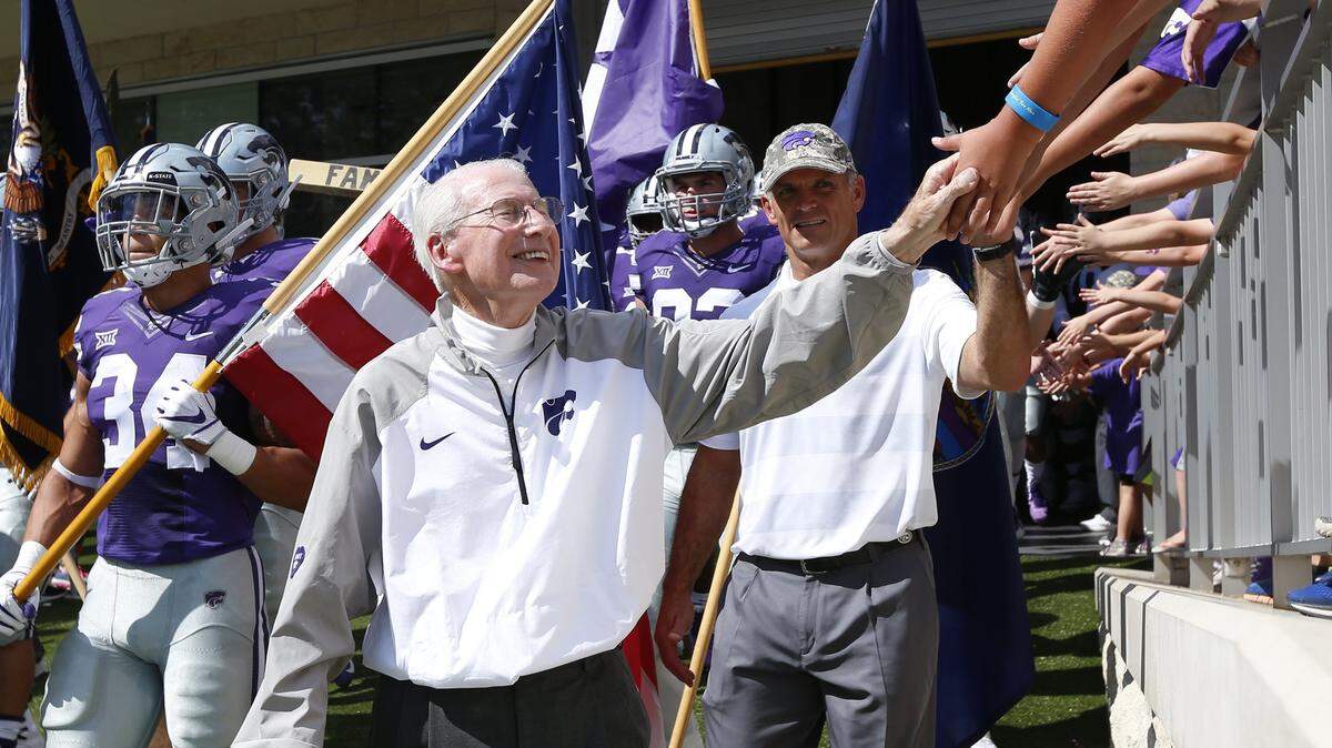 K-State head coach Bill Snyder greats fans as he walks on to the field Saturday in Manhattan. (September 15, 2018)