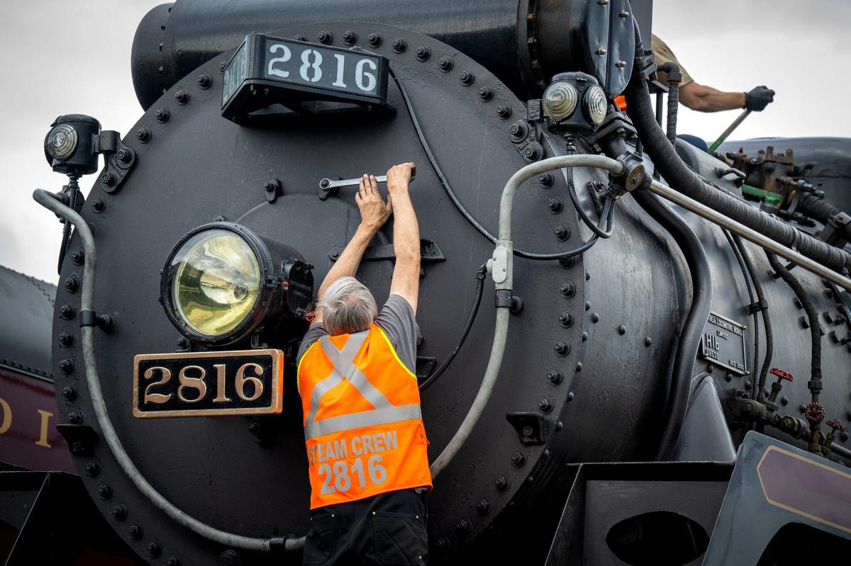 Maintenance work is performed on the Empress 2816, a 1930 steam locomotive, on Thursday, May 16, 2024, at the CPKC rail yard in Kansas City. Canadian Pacific Kansas City (CPKC) is celebrating its’ anniversary, the merger with KC Southern, with the Final Spike Anniversary Steam Tour, which makes a stop at Union Station on Saturday, May 18, 2024.