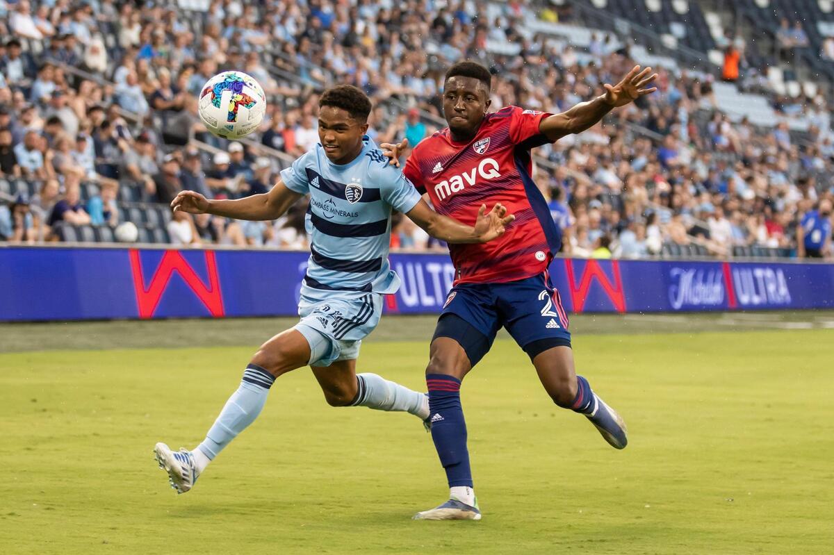 Sporting Kansas City defender Kayden Pierre, left, shields off FC Dallas defender Eddie Munjoma during the teams’ U.S. Open Cup match on Tuesday evening at Children’s Mercy Park.