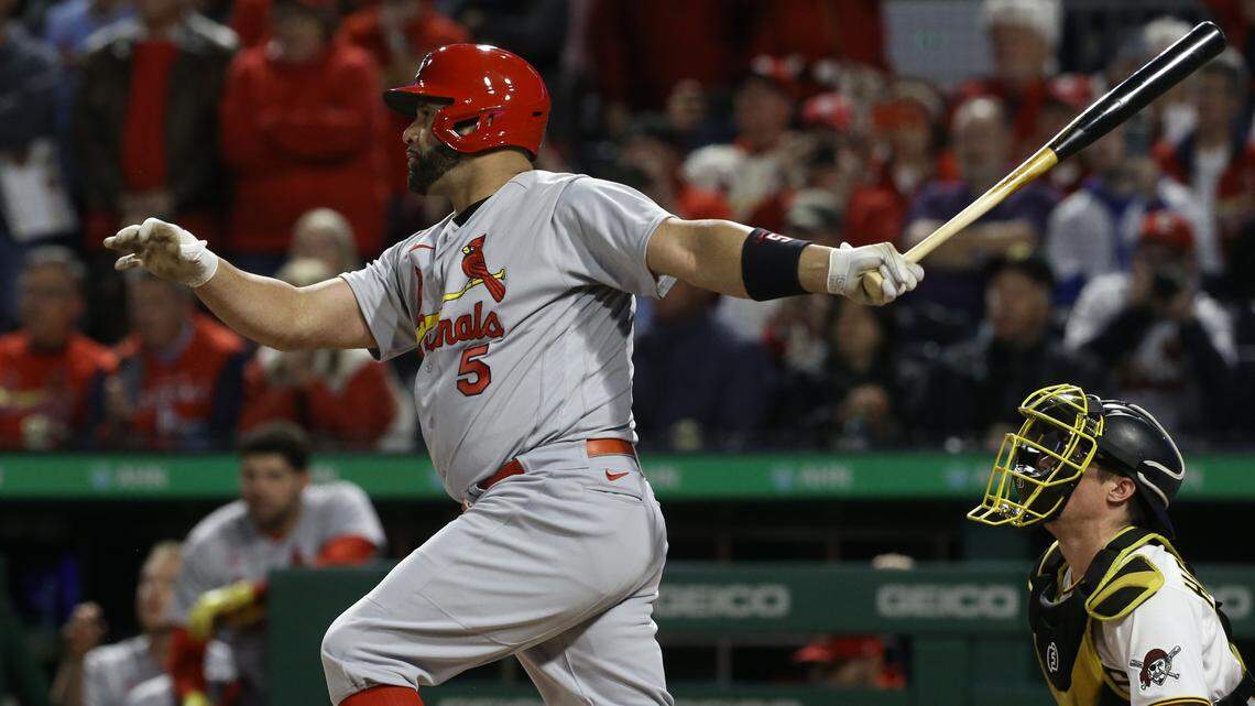 Oct 4, 2022; Pittsburgh, Pennsylvania, USA; St. Louis Cardinals first baseman Albert Pujols (5) hits a two-run single against the Pittsburgh Pirates during the third inning at PNC Park. Mandatory Credit: Charles LeClaire-USA TODAY Sports