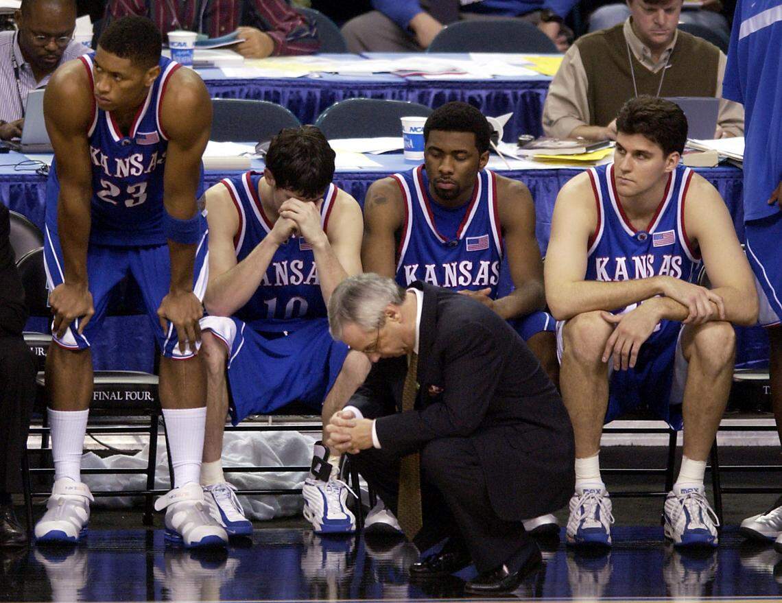 It was hard for the Jayhawks to hide their disappointment in the waning moments of their 2002 Final Four loss to Maryland in Atlanta. Watching the final seconds of their season tick away were coach Roy Williams and players (from left) Wayne Simien, Kirk Hinrich, Keith Langford and Jeff Carey.