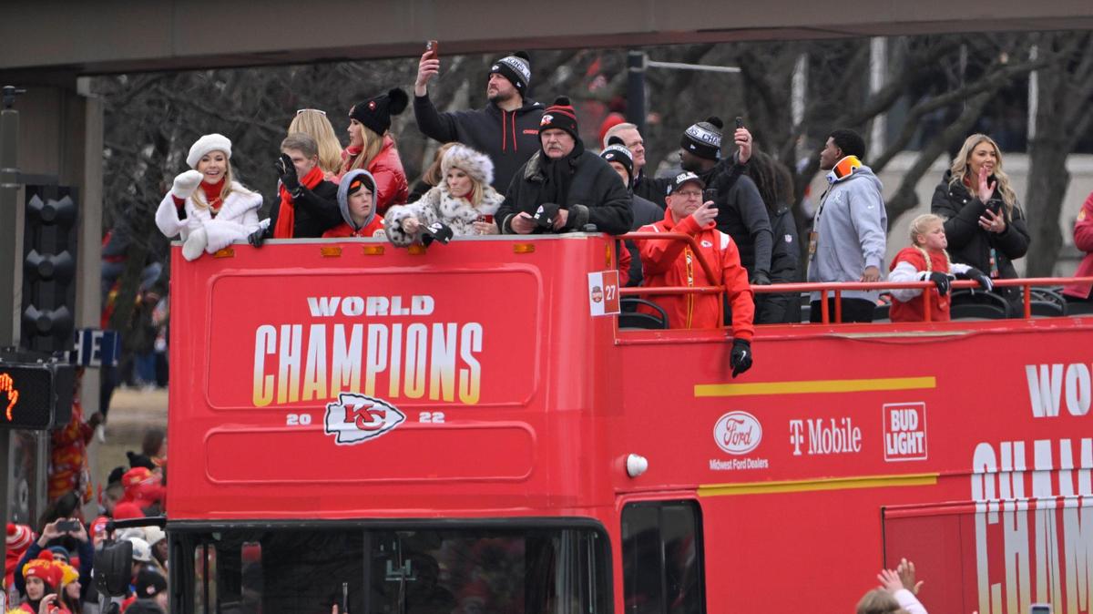 Kansas City Chiefs head coach Andy Reid, his wife, Tammy, team owner Clark Hunt and his wife Tavia Shackles were at the front of one of the buses during the Kansas City Chiefs Super Bowl LVII victory parade Wednesday, Feb. 15, 2023, in downtown Kansas City.