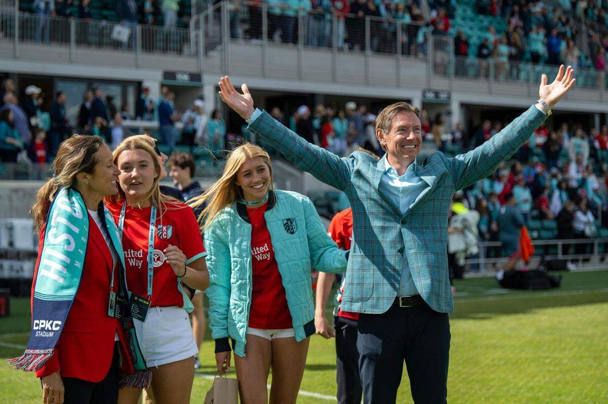 Kansas City Current owners, Angie, far left, and Chris Long, far right, and family celebrate after the Current defeated the Portland Thorns 5-4 in the home opener at the new CPKC Stadium on Saturday, March 16, 2024, in Kansas City.