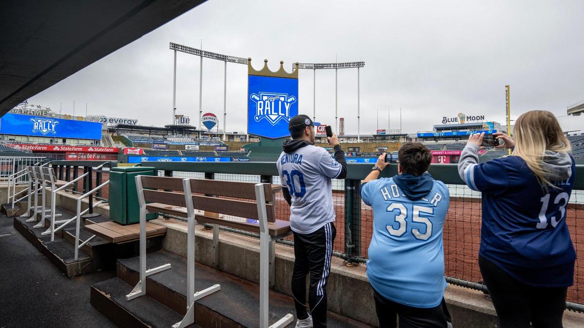 Fans take photos of the field while touring the visitors’ dugout during Royals Rally Fan Fest at Kauffman Stadium on Saturday, Feb. 1, in Kansas City.