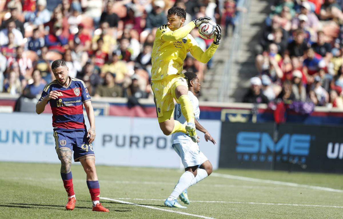 Sporting Kansas City goalkeeper John Pulskamp leaps for the ball during a Major League Soccer match against Real Salt Lake at America First Field in Sandy, Utah on Saturday, April 4, 2026.