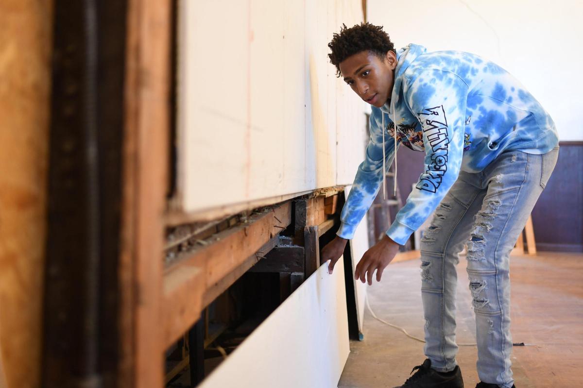 Christian Rich,15, works to assemble drywall during a mentoring session inside the Sankofa Training Center on September 7, 2021 in St. Louis.