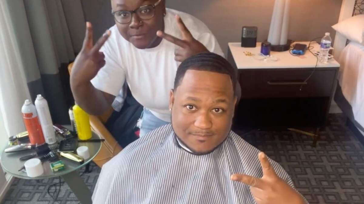 Kansas City barber Danni Woods, who does business as DanniCutIt, gave trombone player Chris Johnson a fresh cut before he played with Beyoncé’s band on their final Renaissance World tour stop at GEHA Field at Arrowhead Stadium on Sunday.