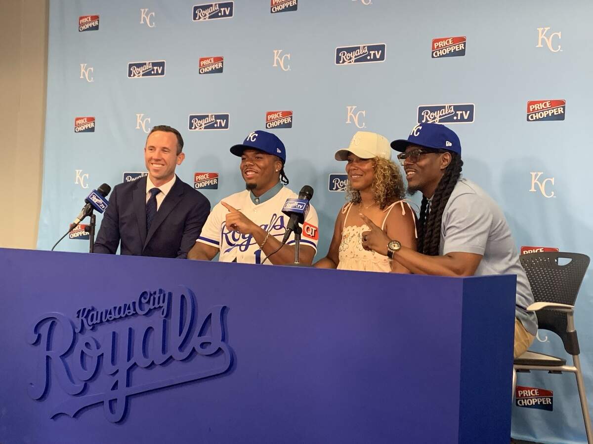 Royals first-round pick Zion Rose poses alongside his parents, Shaun and Karin Rose, and Royals area scout Nick Hamilton at Kauffman Stadium in Kansas City on Saturday, July 18, 2026.