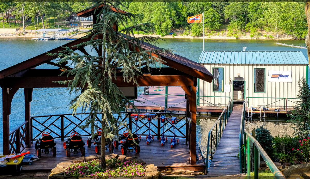 Go-karts are included at the property, waiting on a lakefront patio.