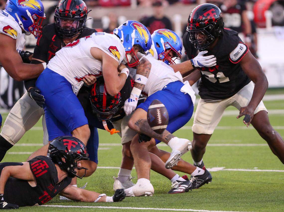 Texas Tech's defense forces a fumble of Kansas' Cole Ballard during a Big 12 Conference football game, Saturday, Oct. 11, 2024 at Jones AT&T Stadium in Lubbock.