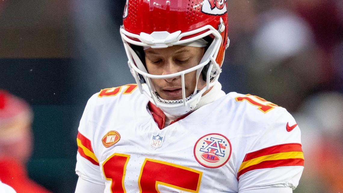 Kansas City Chiefs quarterback Patrick Mahomes (15) looks at his non-throwing hand during an NFL football game against the Denver Broncos at Empower Field at Mile High on Sunday, Oct. 29, 2023, in Denver.