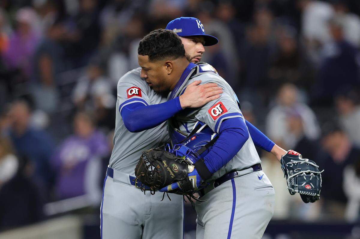 Kansas City Royals pitcher Lucas Erceg (60) reacts with catcher Salvador Perez (13) after the final out of Game 2 of the ALDS against the New York Yankees on Oct. 7, 2024, in Bronx, New York.