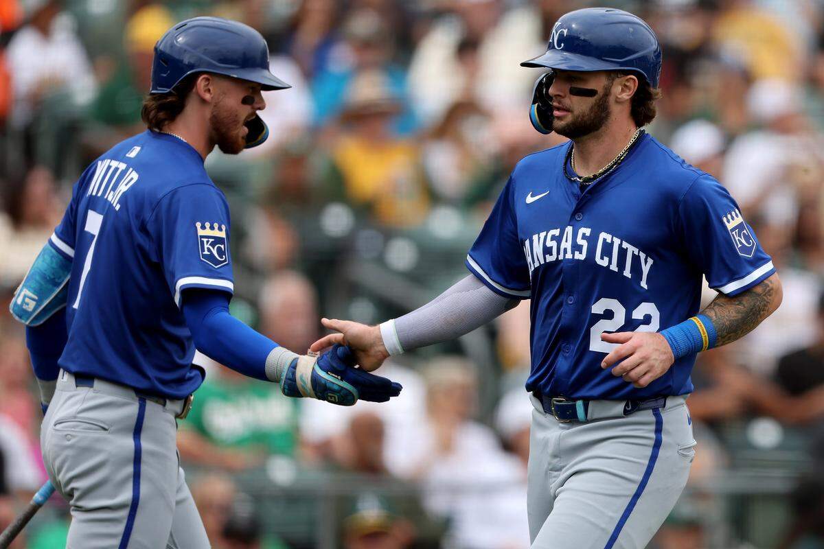 Kansas City Royals catcher Carter Jensen, right, is congratulated by shortstop Bobby Witt Jr. after scoring a run on a sacrifice fly against the Athletics on Sunday, Sept. 28, 2025 at Sutter Health Park in West Sacramento, California.