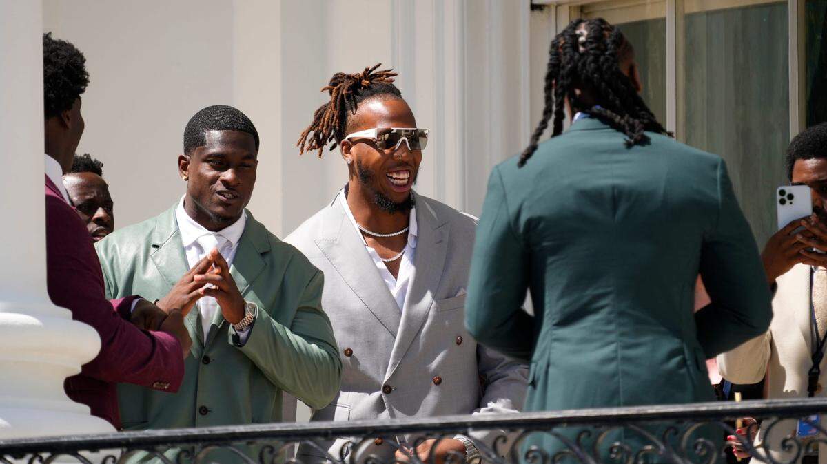 Members of the Kansas City Chiefs gather as they wait for President Joe Biden to welcome the team to the White House to celebrate their Super Bowl LVIII victory.