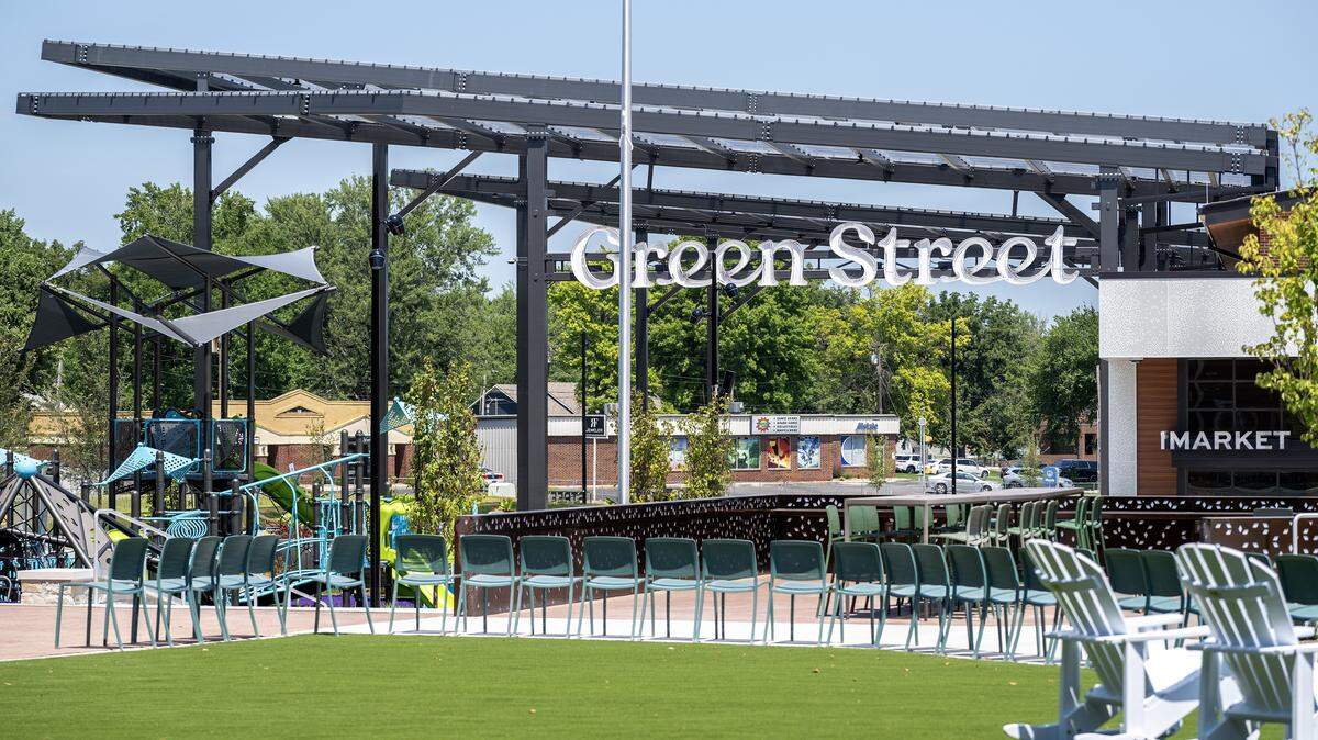 Chairs line a green space near the playground and market entrance at the Green Street development on Tuesday, Aug. 5, in Lee's Summit.
