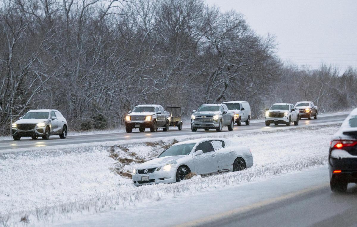 A vehicle went off of a snow packed and slick Kansas 10 Highway in Lenexa after blizzard conditions hit the Kansas City area on Wednesday, March 5, 2025.