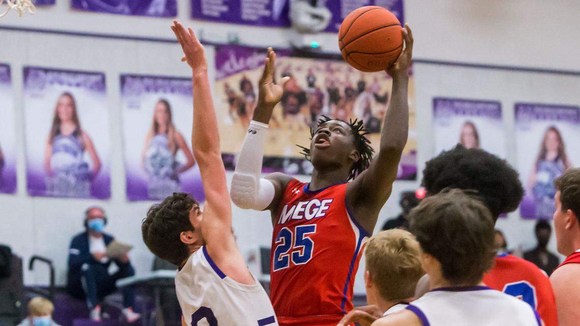 Bishop Miege’s Mark Mitchell Jr. goes up for a score against Blue Valley Northwest at BV Northwest on Friday Feb. 26, 2021.