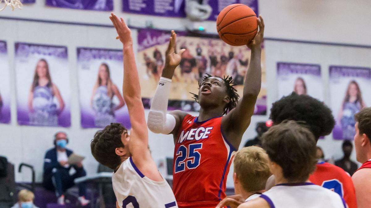 Mark Mitchell goes up for a score against Blue Valley Northwest at BV Northwest on Friday Feb. 26, 2021.