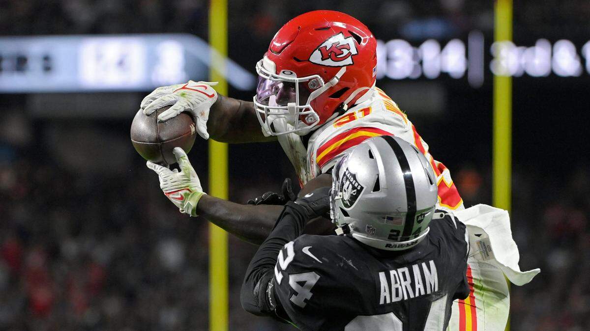 Kansas City Chiefs running back Darrel Williams catches a pass for a touchdown over Las Vegas Raiders safety Johnathan Abram Sunday night.