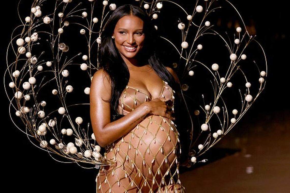 Model Jasmine Tookes and her baby bump opened the show.