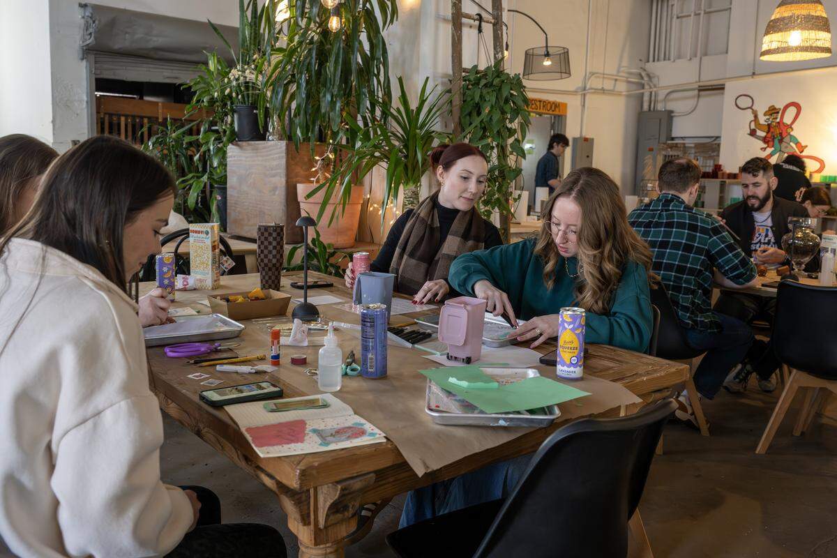 Guests sit at tables while making crafts at ADHDIY Craft Cafe on Saturday, Feb. 7, 2026, in Kansas City.
