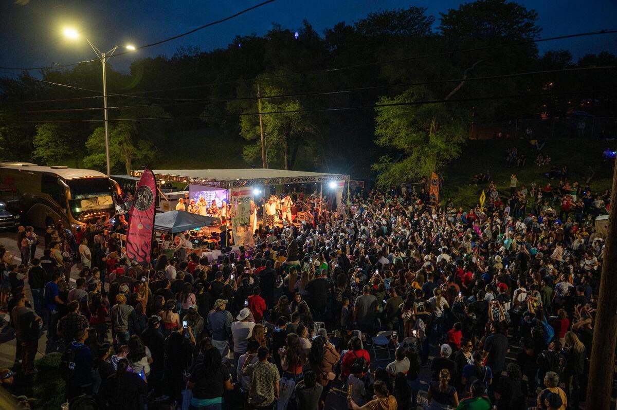 People gather to watch Chicos de Barrio perform during the Cinco de Mayo celebration at Guadalupe Centers on Friday, May 5, 2023, in Kansas City.