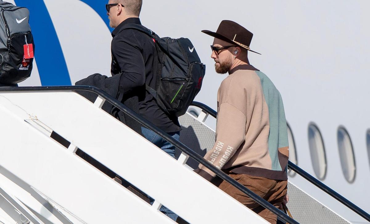 Kansas City Chiefs tight end Travis Kelce boards a plane for the Super Bowl at Kansas City International Airport on Sunday, Feb. 5, 2023, in Kansas City.