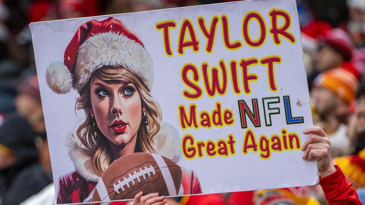 A Kansas City Chiefs fan held a Taylor Swift sign during the Christmas Day game against the Las Vegas Raiders at GEHA Field at Arrowhead Stadium.