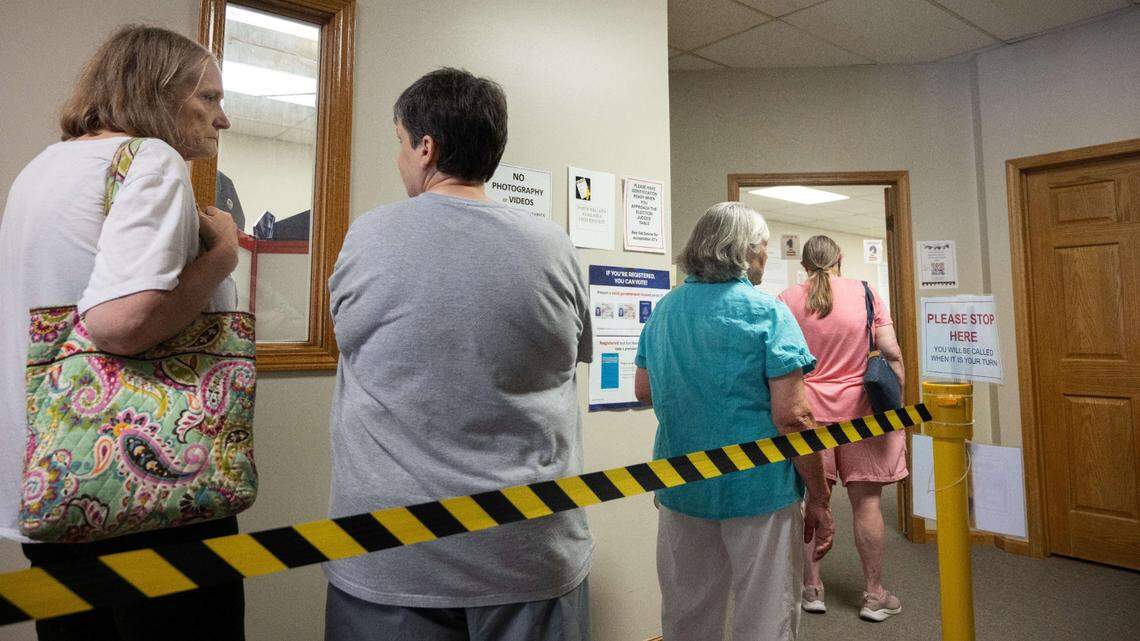 Voters wait to fill out absentee ballots in Jackson County, July 30, 2024.