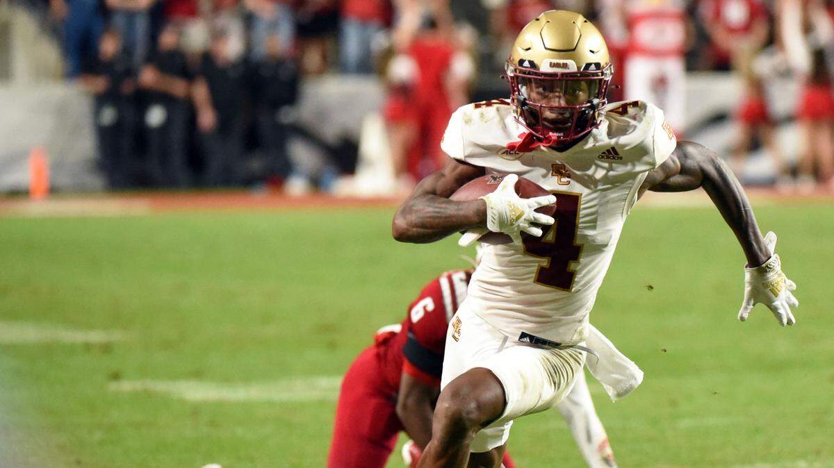 Nov 12, 2022; Raleigh, North Carolina, USA; Boston College Eagles receiver Zay Flowers (4) runs for a touchdown during the second half against the North Carolina State Wolfpack at Carter-Finley Stadium. The Eagles won 21-20. Mandatory Credit: Rob Kinnan-USA TODAY Sports