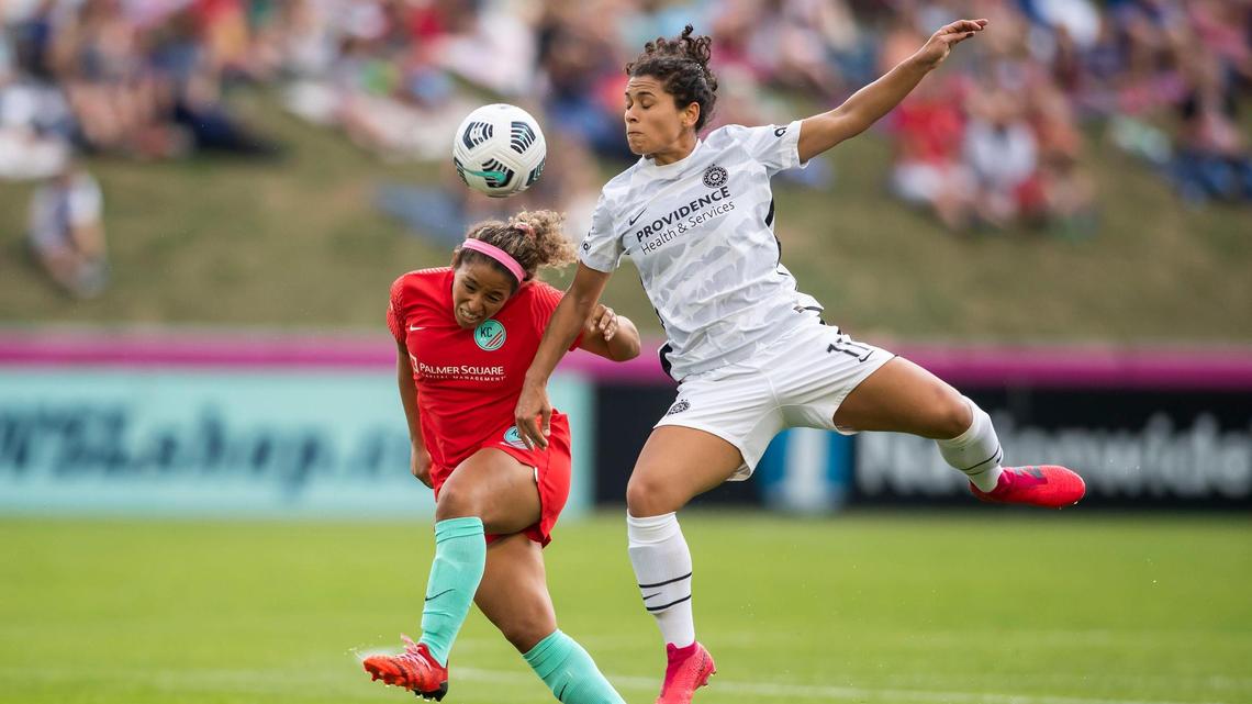 Kansas City midfielder Desiree Scott, left, and Portland Thorns midfielder Raquel Rodríguez fight for the ball during a match last season at Legends Field in Kansas City, Kansas.