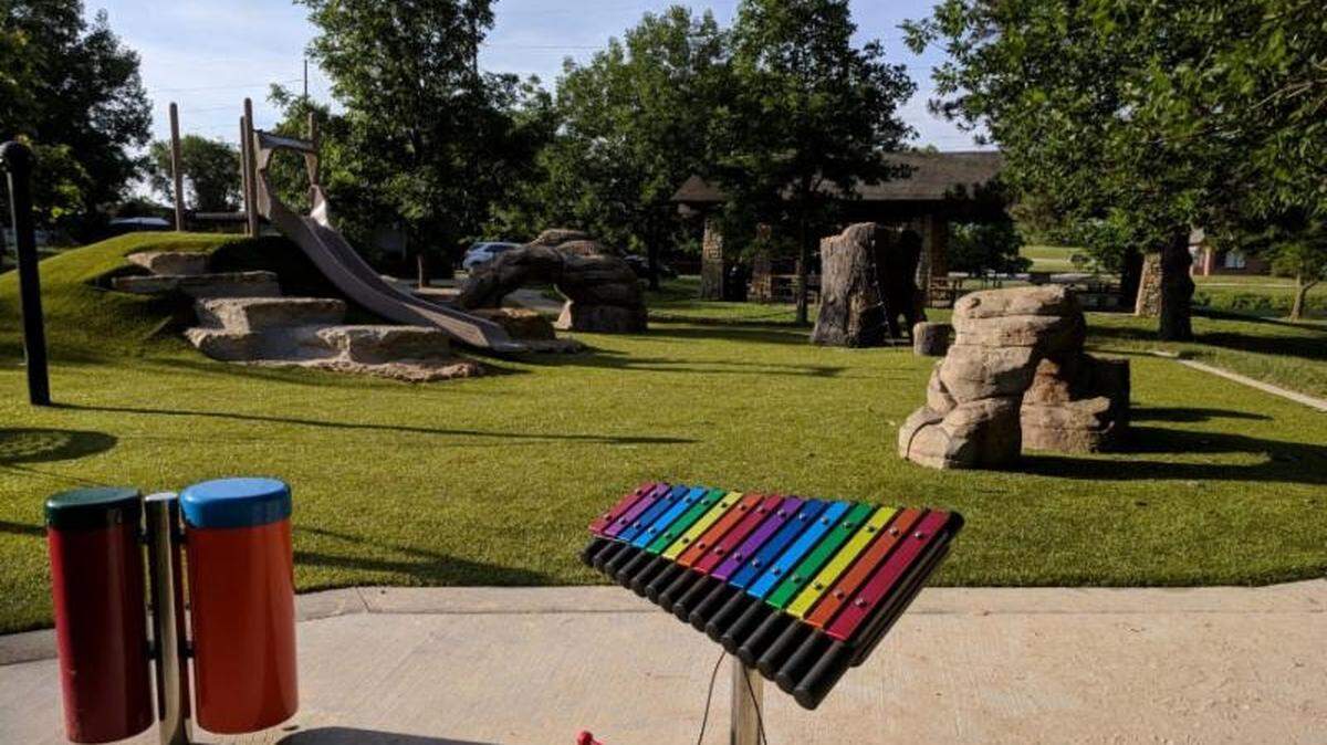 Musical instruments and climbing structures are part of new play area in Frisco Lake Park.