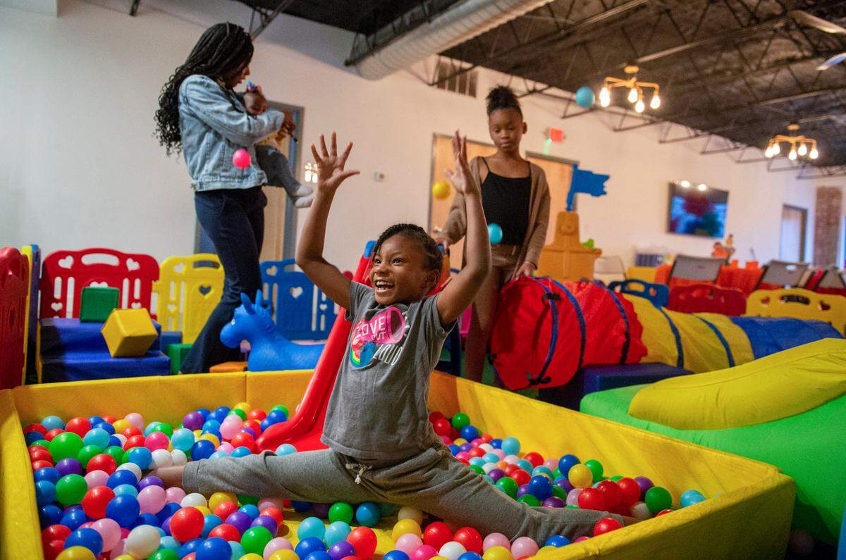 Seven-year-old Liberty Wilson plays in one of Diamond Fuse’s ball pits at a party in Kansas City.