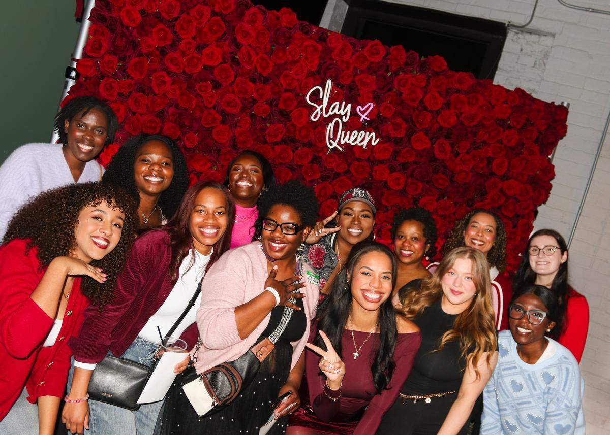 Lauren Scott (fourth person from the left, bottom row) and a group of women attend the Sincerely, Her Valentine’s Day party on Feb. 13 in Kansas City.