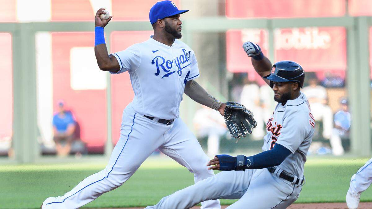 Detroit Tigers’ Niko Goodrum, right, is forced out at second base by Kansas City Royals’ Hanser Alberto for the first half of a double play during the first inning of a baseball game in Kansas City, Mo., Monday, June 14, 2021. (AP Photo/Reed Hoffmann)