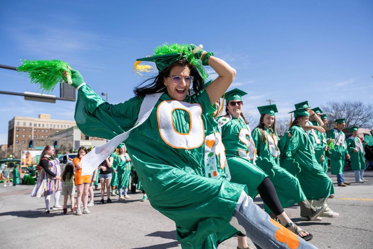 Debbie O’Sullivan and her families’ graduates celebrate and dance in the Kansas City St. Patrick’s Day Parade on Monday, March 17, 2025.