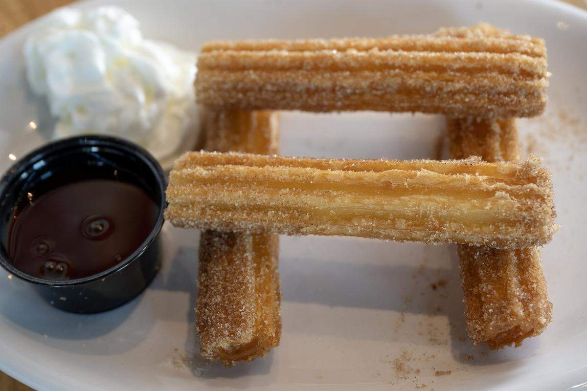 Churros with whipped cream and chocolate sauce at AR's Breakfast and Brunch, 8021 Metcalf Ave., in Overland Park.