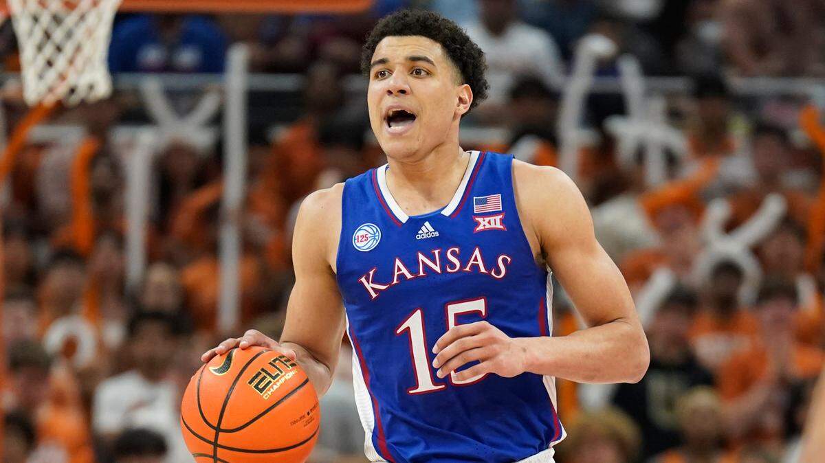 Kansas Jayhawks guard Kevin McCullar Jr. (15) looks to the pass the ball during the second half against the Texas Longhorns at Moody Center on March 4, 2023.