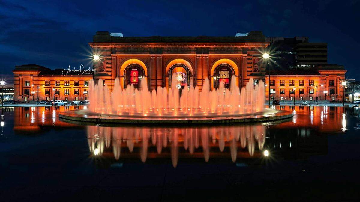 Kansas City’s Union Station lit up in orange two weeks ago to honor the announcement of Taylor Swift’s 12th album, “The Life of a Showgirl.” It will light up again Tuesday night to celebrate Swift’s engagement to KC Chiefs player Travis Kelce.