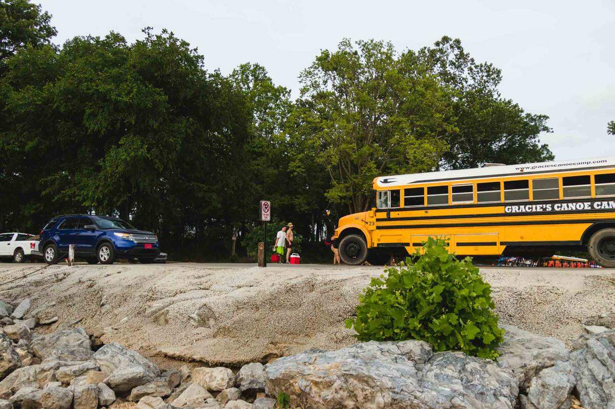A Gracie’s campground bus drives over Low Water Bridge June 26 on the Elk River. Majority of campgrounds in McDonald County use school buses to haul tourist to and from float trips.