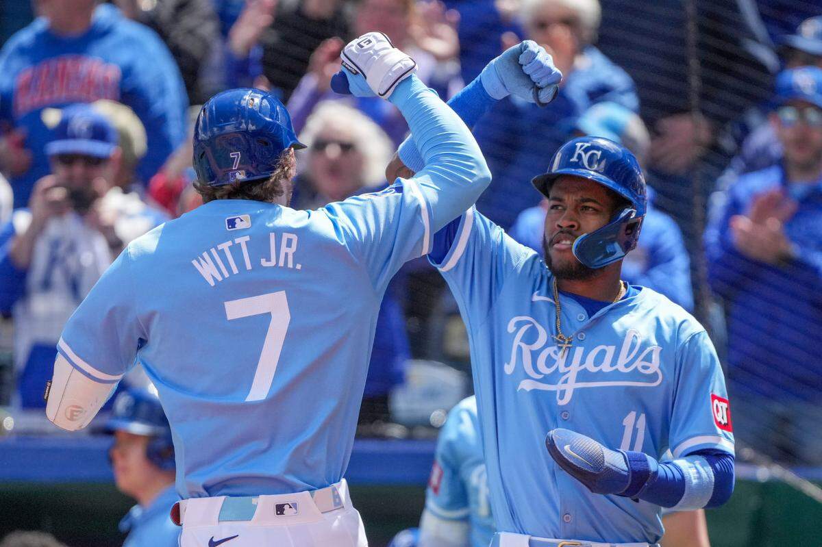 Kansas City Royals shortstop Bobby Witt Jr. (7) celebrates with third baseman Maikel Garcia (11) after hitting a two-run home run against the Houston Astros in the first inning at Kauffman Stadium on April 11, 2024.