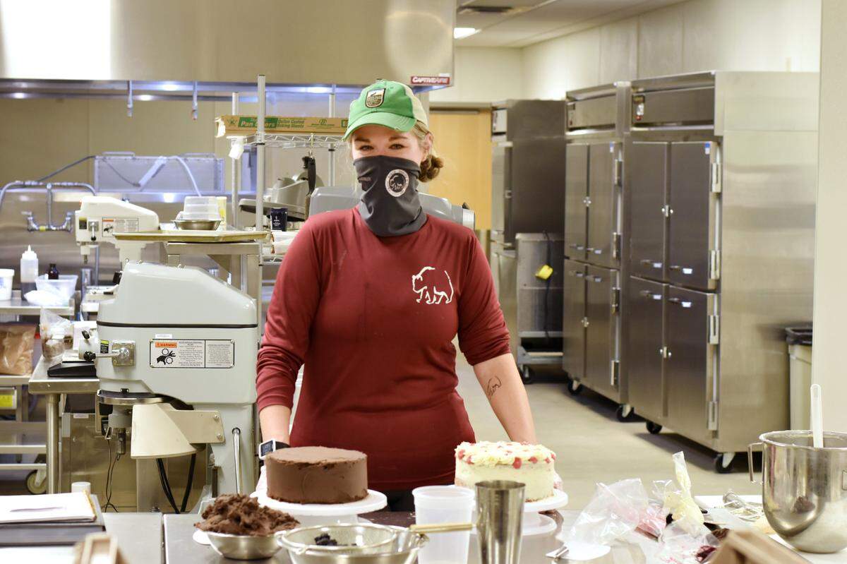 Natalie Olds bakes a white almond raspberry cake and a chocolate blackberry cake.