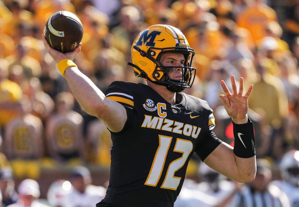 Missouri Tigers quarterback Brady Cook throws a pass during the first half of Saturday’s game against the Auburn Tigers at Faurot Field at Memorial Stadium.