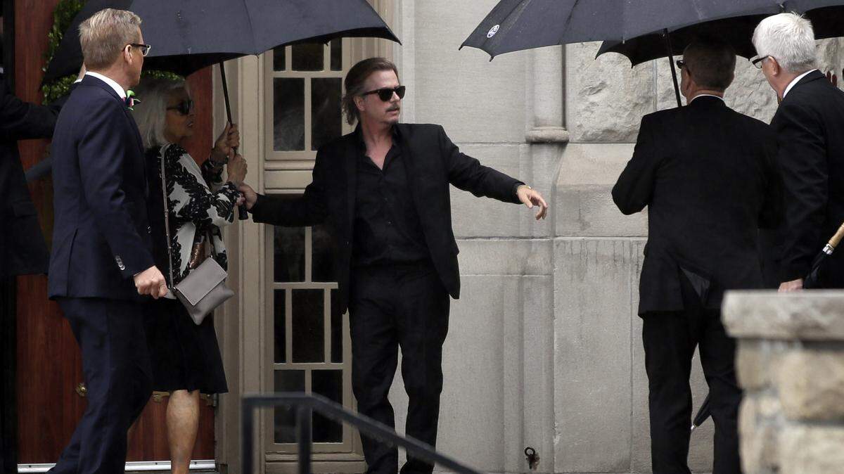 Actor-comedian David Spade helps family members enter Our Lady of Perpetual Help Redemptorist Catholic Church for funeral services for his sister-in-law, designer Kate Spade, in Kansas City on June 21.