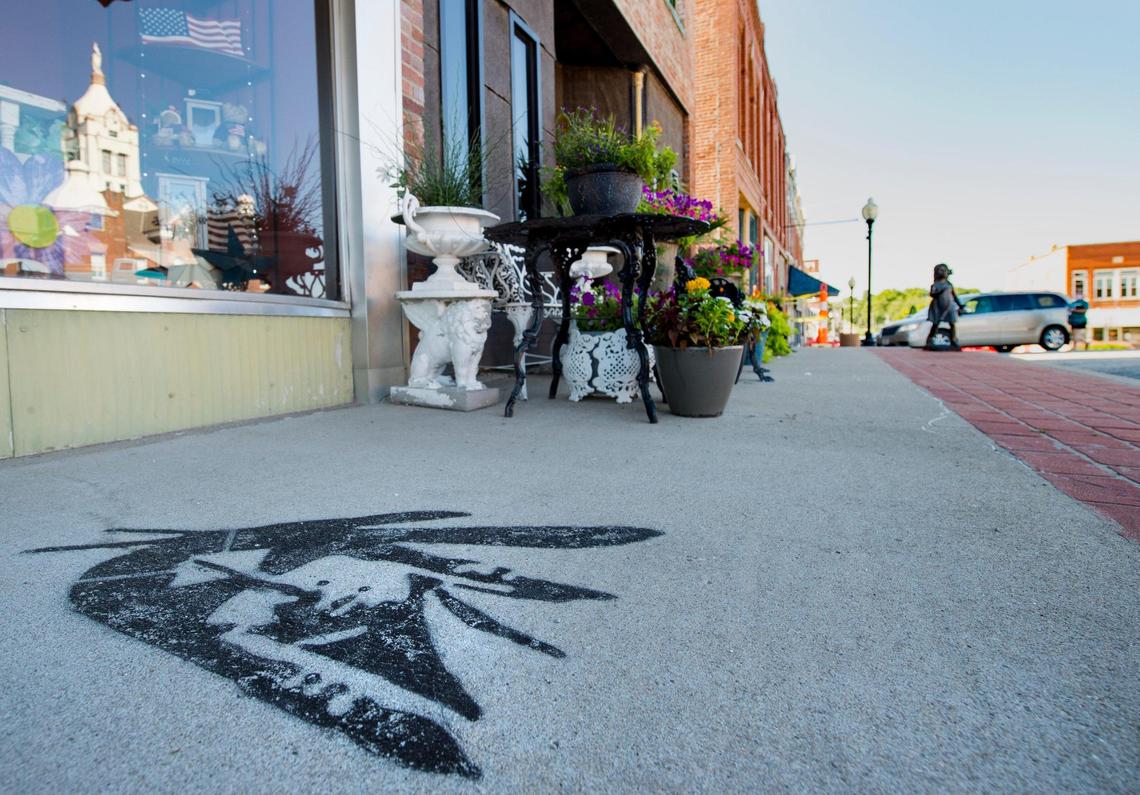 A stenciled painting, one of several, of the school mascot is painted on the sidewalk in downtown Savannah, Missouri. 