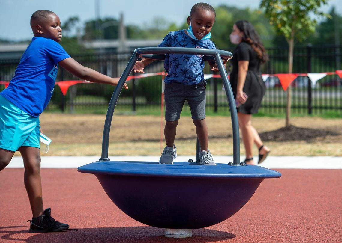Latreal Johnson, 9, pushed his brother, Christopjer Allen, 5, both of Kanas City, at the new 15 and the Mahomies Playground at Martin Luther King, Jr. Park on Saturday, Aug. 28, 2021, at Dr. Martin Luther King, Jr. Blvd. & Woodland Ave., in Kansas City. Chiefs quarterback’s Patrick Mahomes foundation, 15 and the Mahomies Foundation donated $1 million to help transform the park making it accessible for children of all abilities.