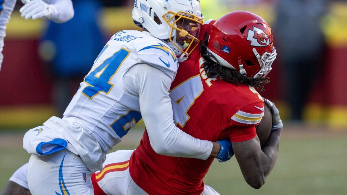 Kansas City Chiefs wide receiver Rashee Rice (4) is tackled by Los Angeles Chargers cornerback Benjamin St-Juste (24) in the second half on Sunday, Dec. 14, 2025 at GEHA Field at Arrowhead Stadium in Kansas City. The Chargers defeated the Chiefs, 16-13.