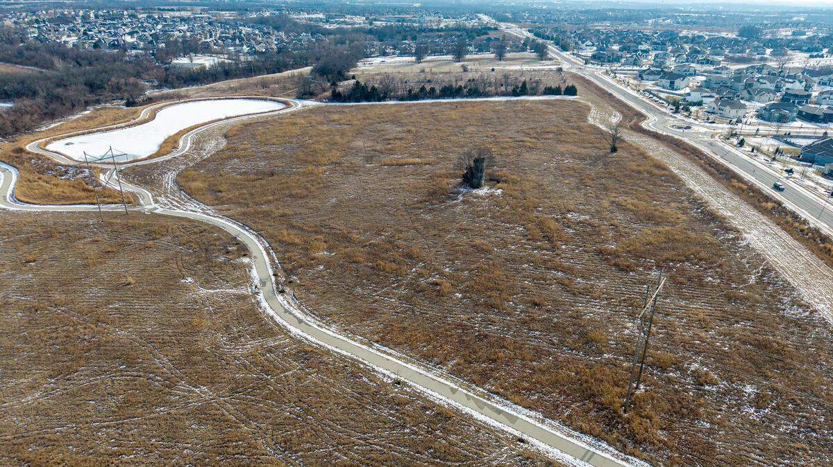 The Clear Creek Trail, located off of Clare Road near 86th Terrace in Lenexa, is seen on Monday, Feb. 2, 2026. The walking trail leads to a small lake and a wetlands area. There is a proposal before the city for a 50-home Habitat for Humanity development on the land.