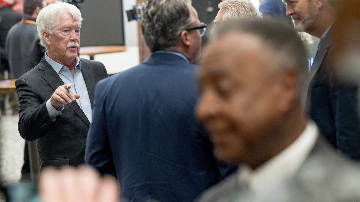 Kansas City Royals owner John Sherman points toward Jackson County Executive Frank White as he speaks to reporters during a press conference detailing proposed renovations to Arrowhead Stadium in February.